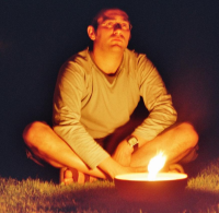 Photo of a developer sitting behind a candle in the garden discussing the roadmap